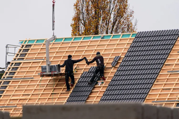 new roof installation Roof tile rep[lacement by two men